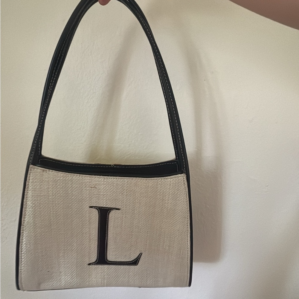Elegant Cream and Black Handbag